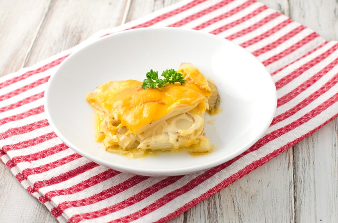 Cheesy Scalloped Potatoes Recipe | This easy scalloped potatoes recipe is full of cheesy goodness. It’s great as a side dish for just about any meal, but especially during Thanksgiving and Christmas with ham or a standing rib roast. I’ll admit I even like to eat the leftovers for breakfast! Cheesy Scalloped Potatoes Recipe | This easy scalloped potatoes recipe is full of cheesy goodness. It’s great as a side dish for just about any meal, but especially during Thanksgiving and Christmas with ham or a standing rib roast. I’ll admit I even like to eat the leftovers for breakfast!