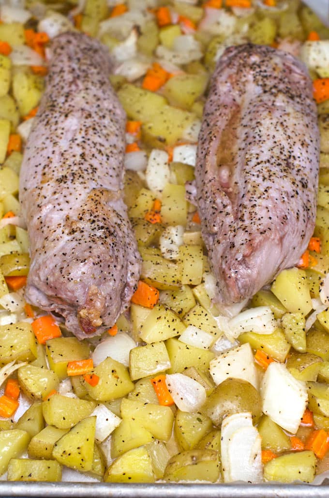 Pork Tenderloin with Roasted Vegetables Recipe | I love this pork tenderloin recipe for easy weeknight dinners! It has little prep and cooks your meat and veggies all in the same pan in under an hour.