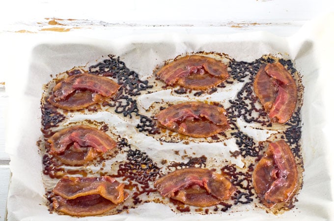Candied Bacon Footballs recipe candied bacon on baking sheet fresh from the oven