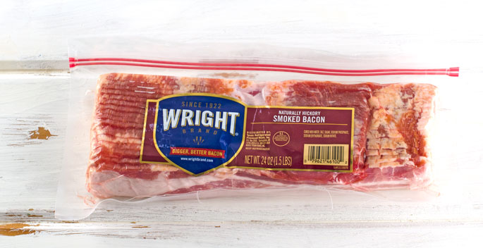 Candied Bacon Footballs Recipe - Wright Brand Bacon in packaging on white washed table top